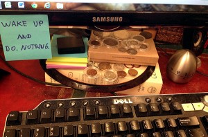 coins next to computer