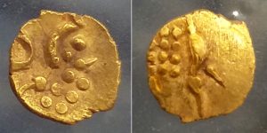 gold fanum coin close up